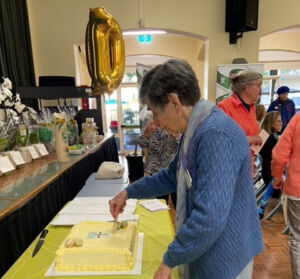 Sr Maureen cutting the cake